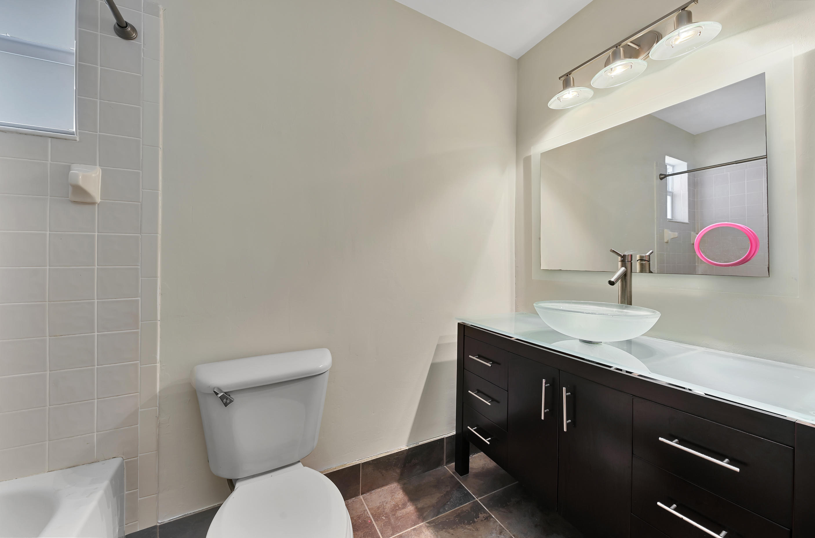242 Northwest 12th Avenue Boca Raton, FL 33486 - Photo 9 of 13 a bathroom with a sink toilet and shower
