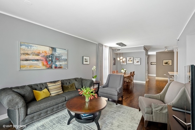 744 North Clark Street, Unit 801 Chicago, IL 60654 - Photo 3 of 12 a living room with furniture