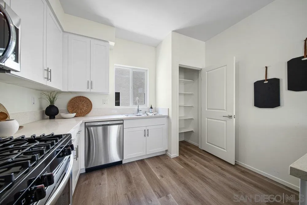 8178 Golden Avenue Lemon Grove, CA 91945 - Photo 13 of 50 a kitchen with granite countertop a stove and a refrigerator