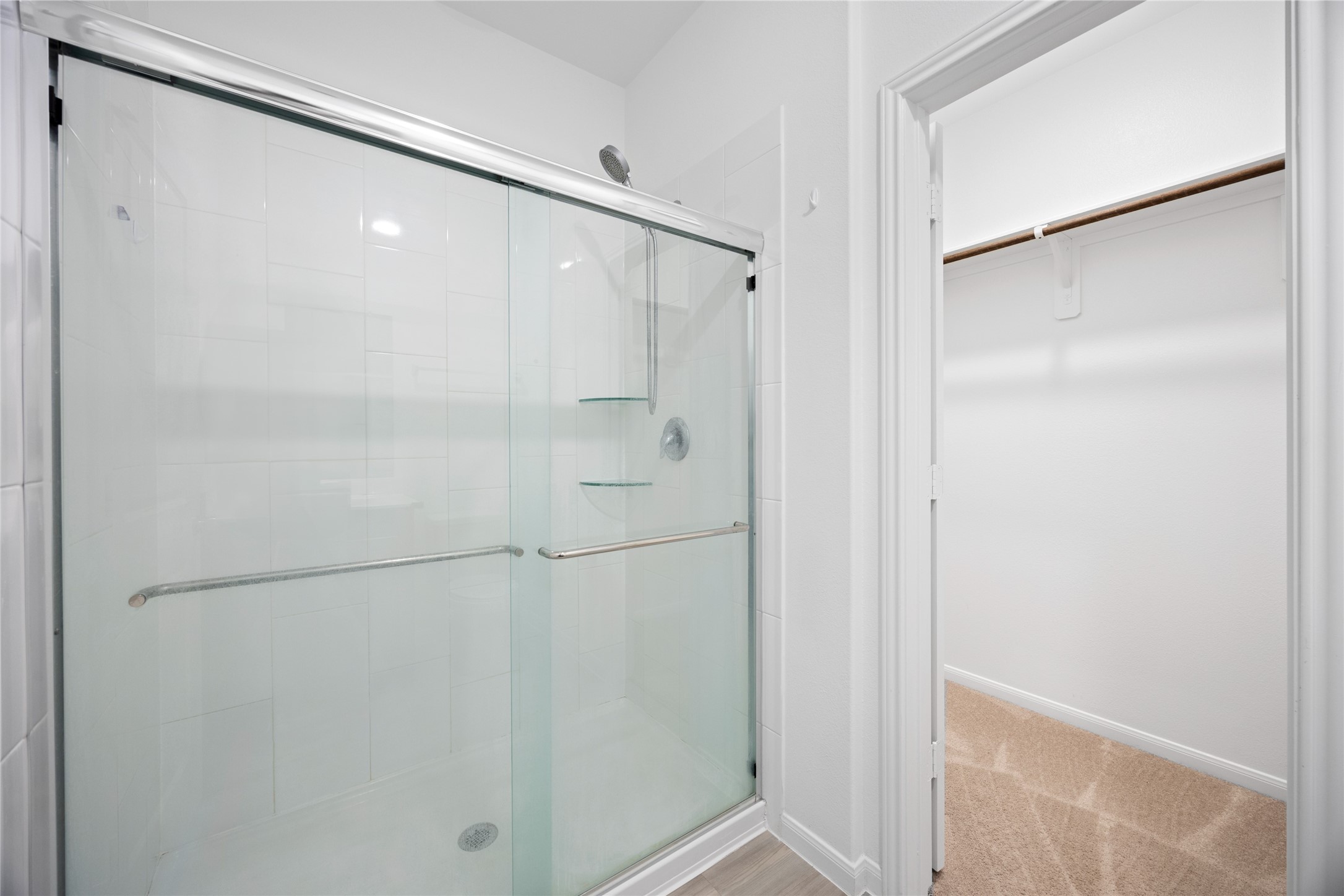 17907 Grain Auger Road Hockley, TX 77447 - Photo 22 of 24 Modern bathroom with a glass-enclosed shower and adjacent spacious walk-in closet.