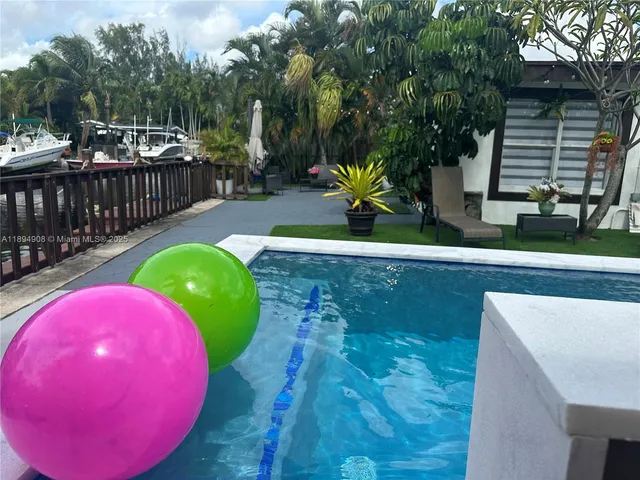 a view of a swimming pool with a patio
