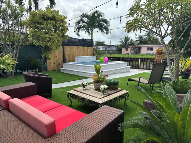 a view of yard with patio and outdoor seating