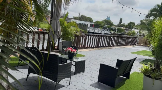 a view of a chairs and table in the balcony