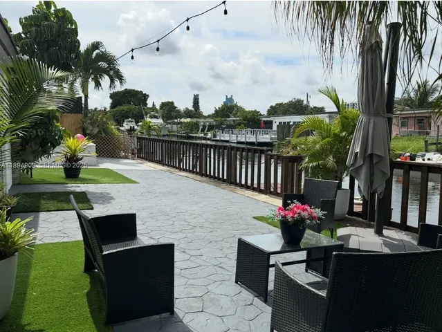 a view of house with outdoor space and sitting area