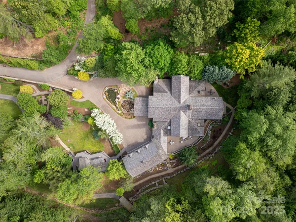 an aerial view of a house with outdoor space