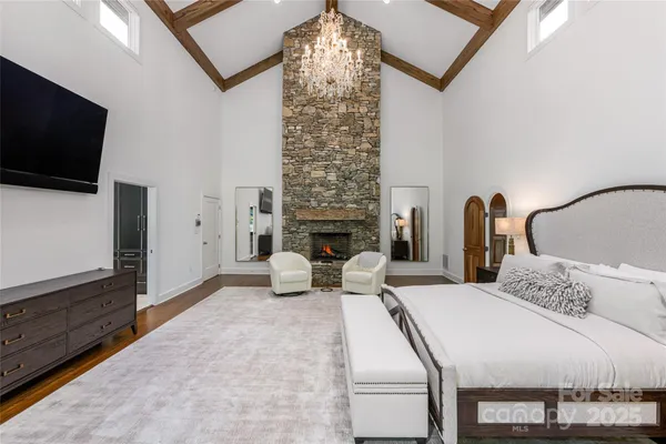 a living room with a bed furniture and a fireplace