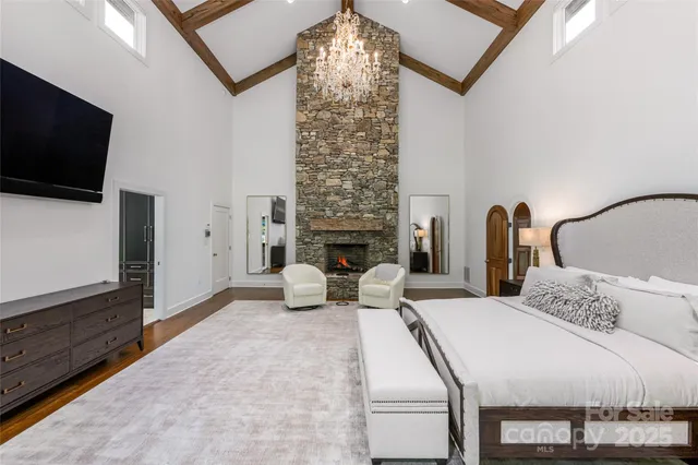 a living room with a bed furniture and a fireplace