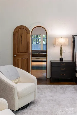 a large room with a large window and furniture