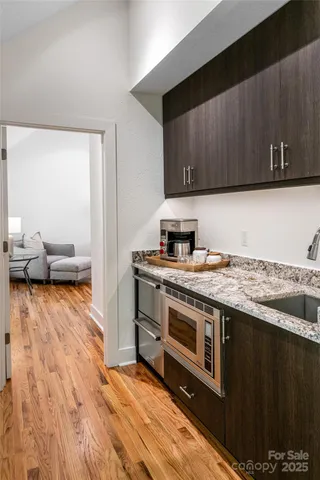 a living room with furniture pool table and flat screen tv