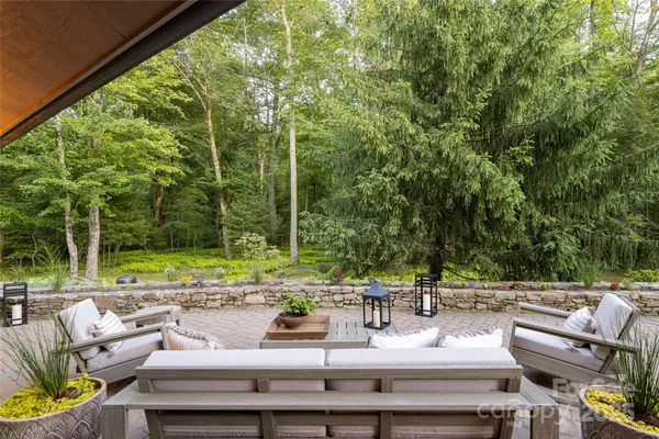 a front view of a house with yard and green space