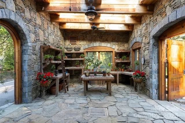 a view of a chairs and table in a patio