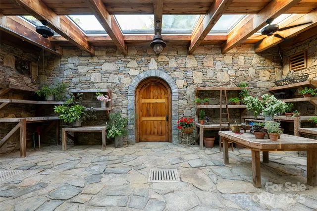 a view of a big yard with green space and mountain view in back