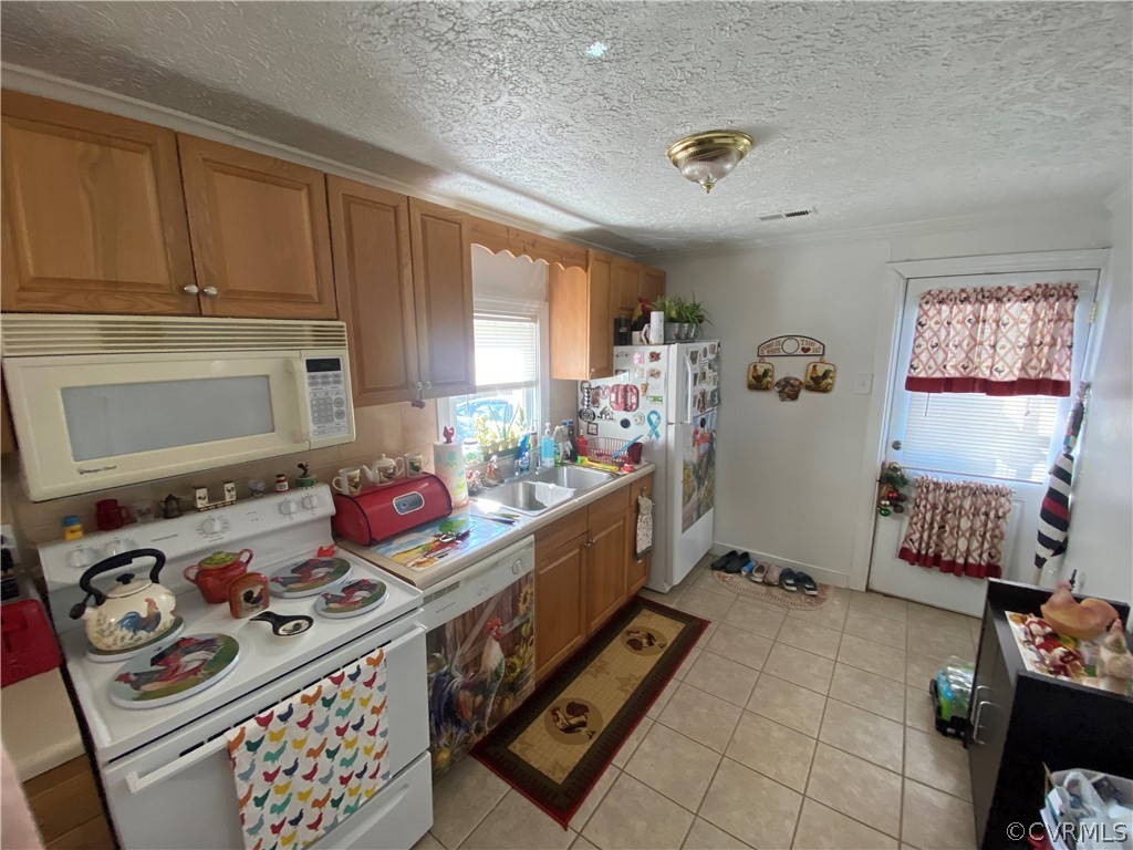 8220 Lee Davis Road Mechanicsville, VA 23111 - Photo 3 of 11 a kitchen with stainless steel appliances a stove a sink and a refrigerator