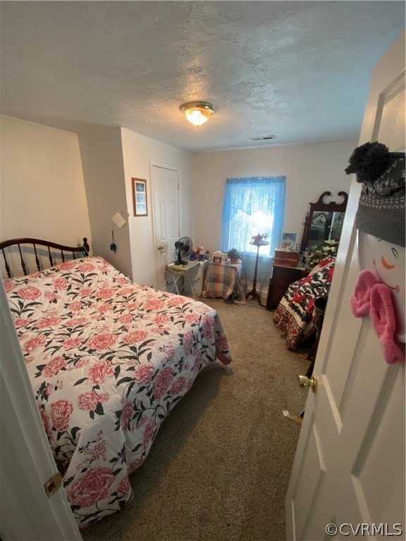 8220 Lee Davis Road Mechanicsville, VA 23111 - Photo 4 of 11 a bed sitting in a bedroom next to a window