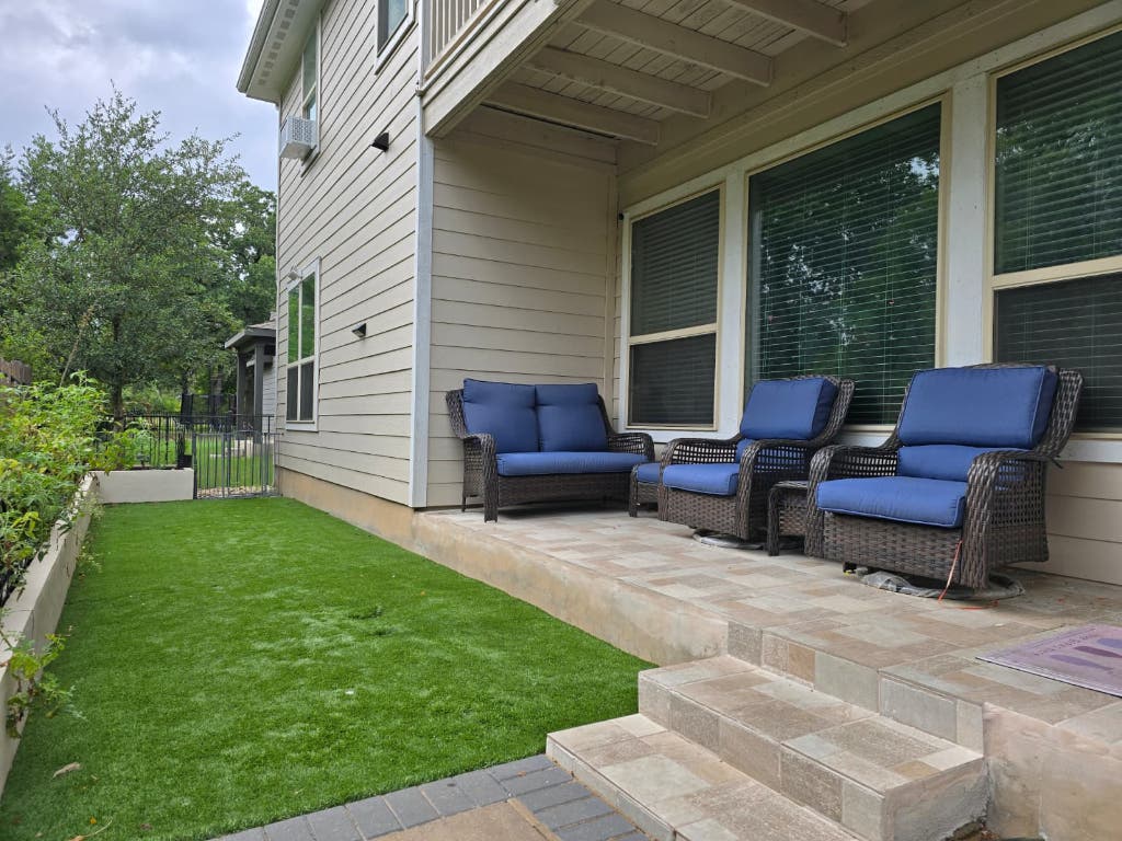 9713 McKnight Loop, Unit 34 Austin, TX 78717 - Photo 16 of 17 a backyard of a house with table and chairs