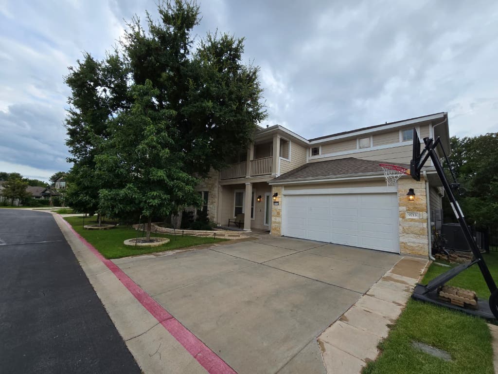 9713 McKnight Loop, Unit 34 Austin, TX 78717 - Photo 2 of 17 a view of a house with a yard
