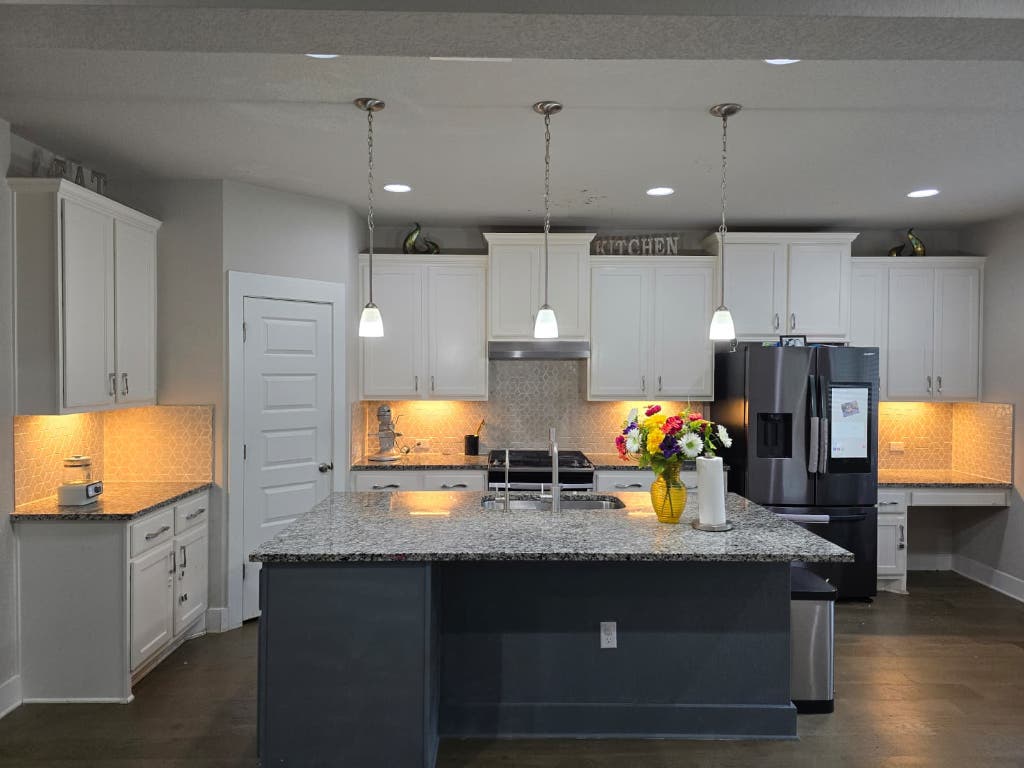 9713 McKnight Loop, Unit 34 Austin, TX 78717 - Photo 7 of 17 a kitchen with stainless steel appliances granite countertop a stove and a sink