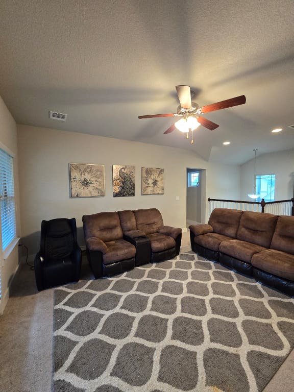 9713 McKnight Loop, Unit 34 Austin, TX 78717 - Photo 8 of 17 a living room with furniture and a lamp