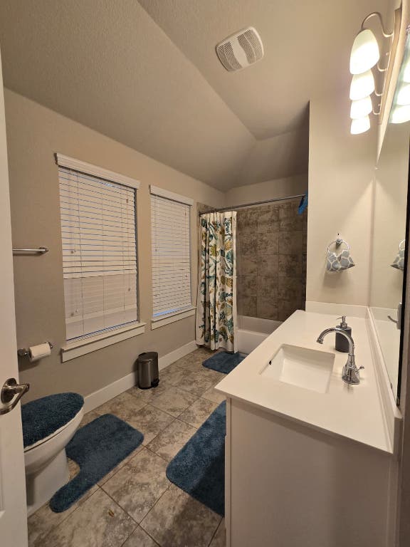 9713 McKnight Loop, Unit 34 Austin, TX 78717 - Photo 10 of 17 a bathroom with a sink and a mirror