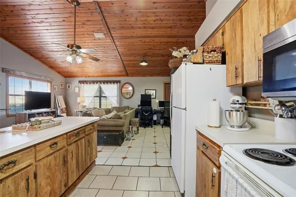 a kitchen with a refrigerator and a sink