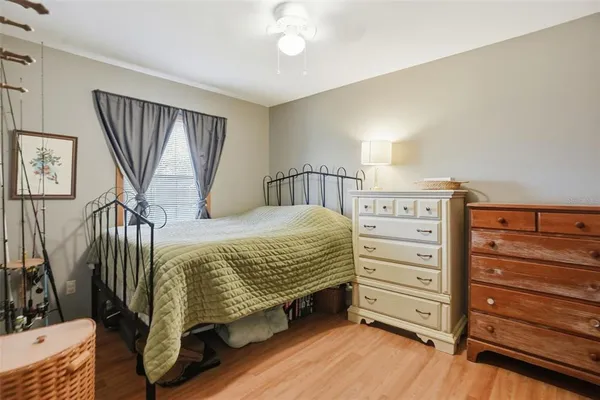 a bedroom with a bed and a dresser
