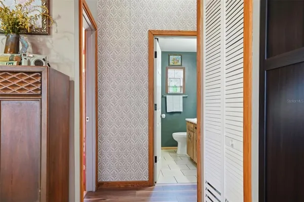 a view of a bathroom from a hallway