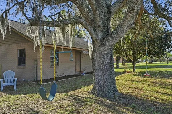 a view of a yard with table and chairs