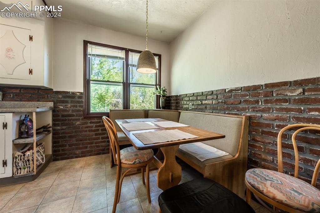 2233 Daniel Road Pueblo, CO 81006 - Photo 11 of 48 a view of a dining room with furniture window and outside view