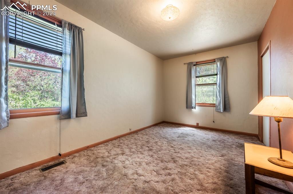 2233 Daniel Road Pueblo, CO 81006 - Photo 16 of 48 an empty room with window