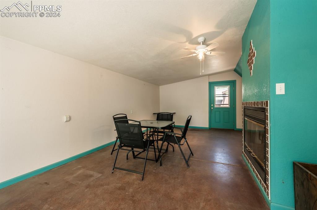 2233 Daniel Road Pueblo, CO 81006 - Photo 27 of 48 a dining room with furniture and window