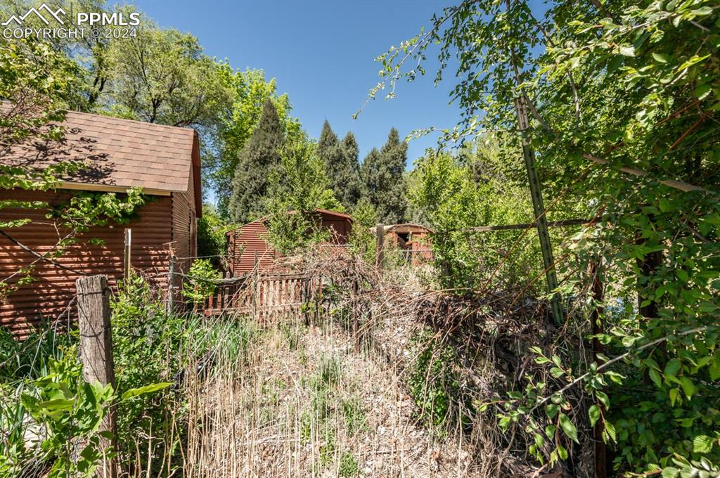 2233 Daniel Road Pueblo, CO 81006 - Photo 34 of 48 a view of a house with a tree