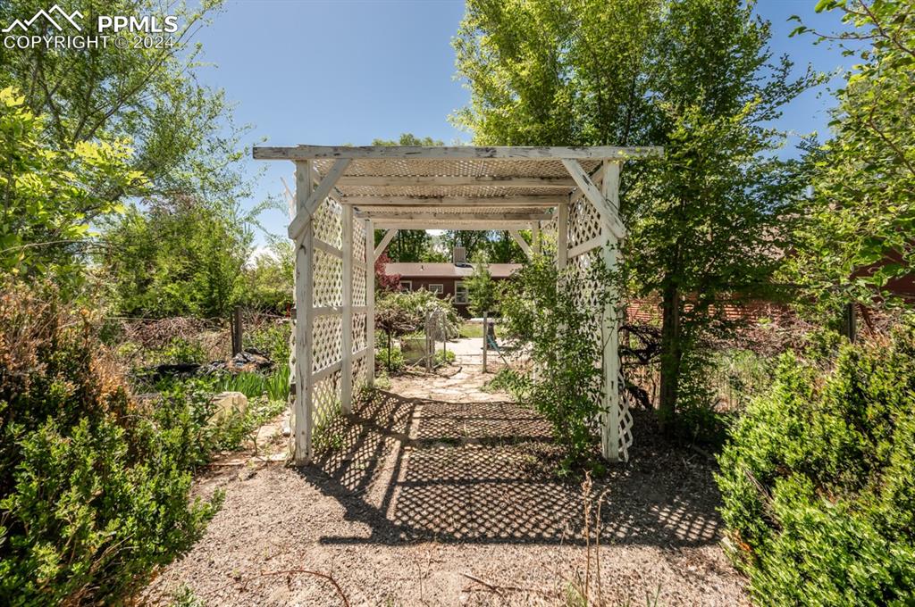 2233 Daniel Road Pueblo, CO 81006 - Photo 36 of 48 a view of a pathway with a tree