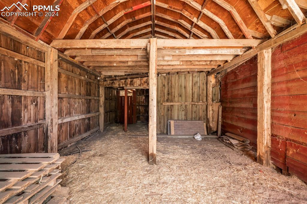 2233 Daniel Road Pueblo, CO 81006 - Photo 42 of 48 a view of an empty room with wooden floor and a ceiling fan