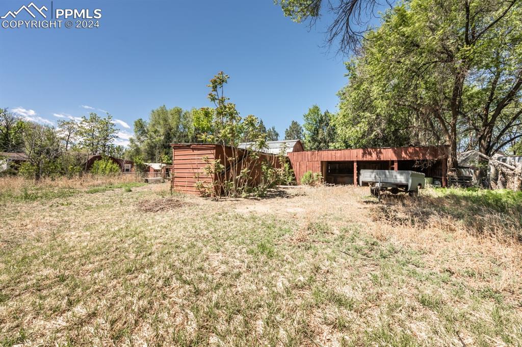 2233 Daniel Road Pueblo, CO 81006 - Photo 46 of 48 a front view of a house with a yard