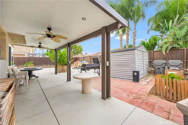 a view of a patio with a table and chairs