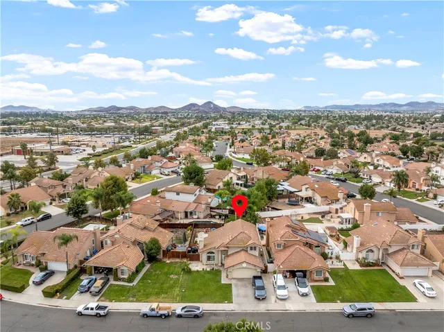 an aerial view of residential houses with outdoor space