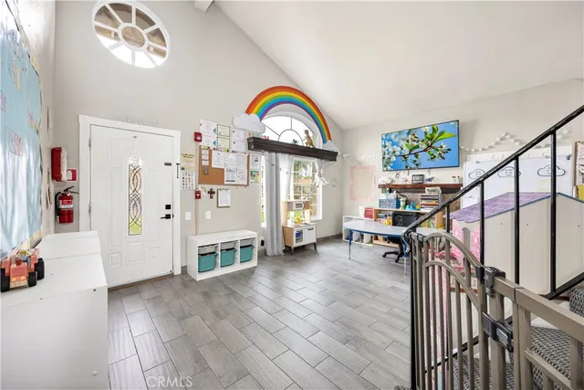 a view of an entryway with wooden floor