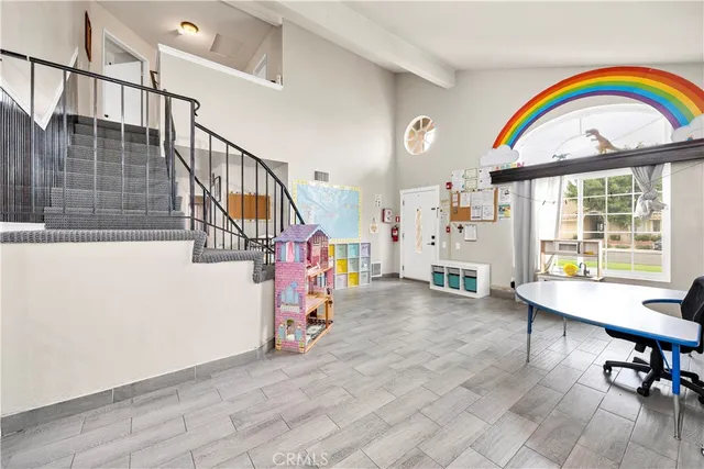 a view of entryway with hall and wooden floor