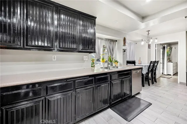 a kitchen with a sink and cabinets