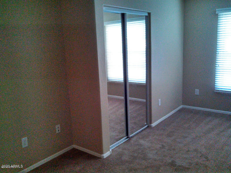 4081 East Windsor Drive Gilbert, AZ 85296 - Photo 6 of 8 an empty room with windows