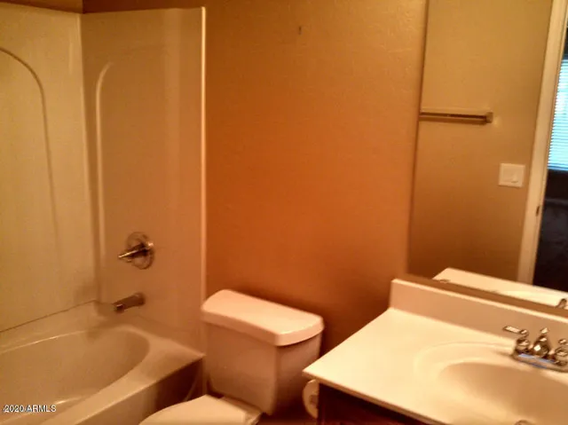 a bathroom with a toilet and a sink