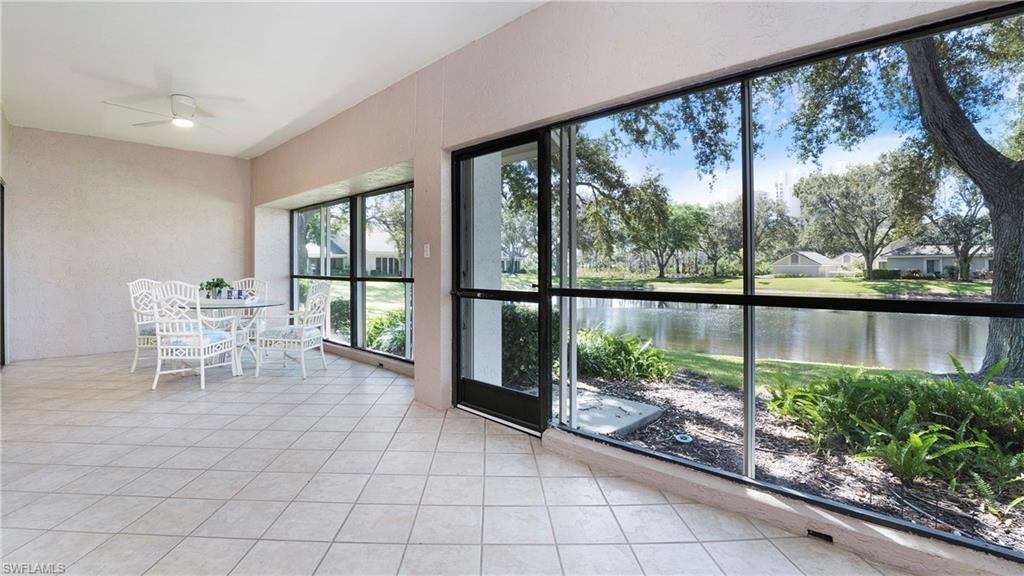 606 Arbor Lake Drive, Unit 6104 Naples, FL 34110 - Photo 23 of 36 a view of a chairs and table in a balcony