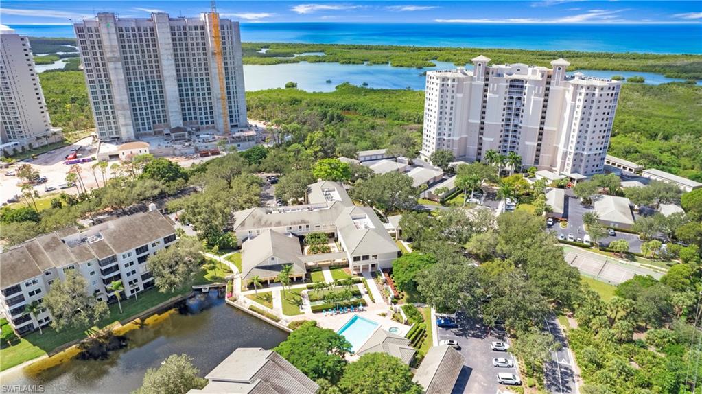 606 Arbor Lake Drive, Unit 6104 Naples, FL 34110 - Photo 24 of 36 a view of a city with tall buildings