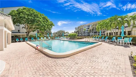 a view of a swimming pool with a patio
