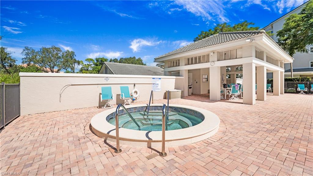 606 Arbor Lake Drive, Unit 6104 Naples, FL 34110 - Photo 26 of 36 a front view of a house with swimming pool