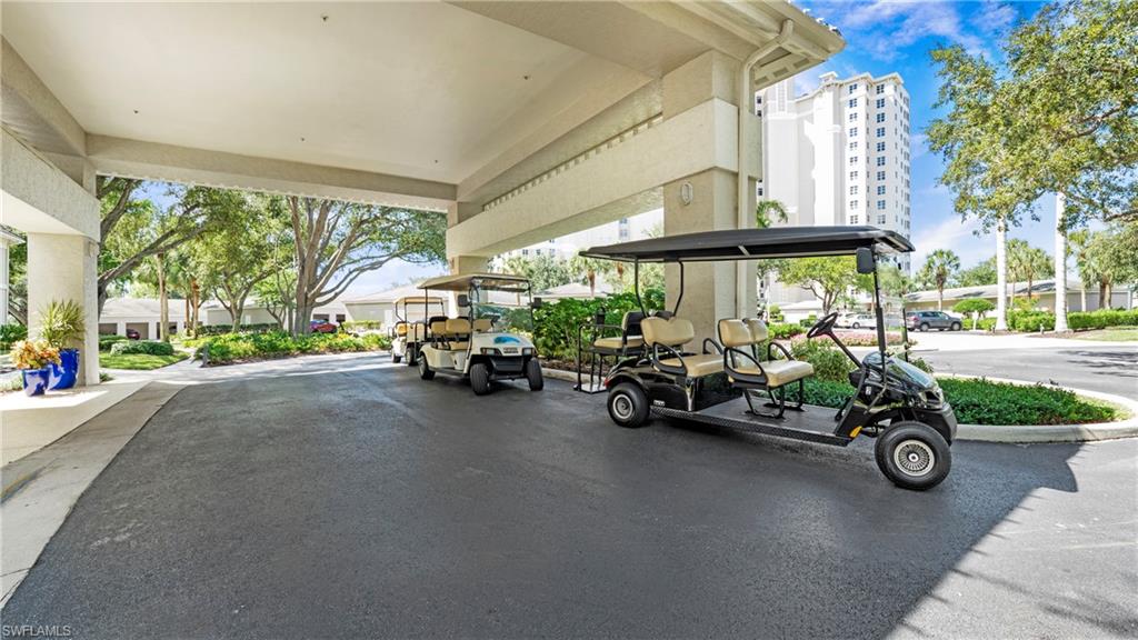 606 Arbor Lake Drive, Unit 6104 Naples, FL 34110 - Photo 29 of 36 a car is parked in front of a building