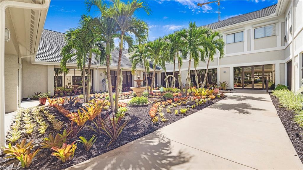 606 Arbor Lake Drive, Unit 6104 Naples, FL 34110 - Photo 32 of 36 a view of a backyard of the house
