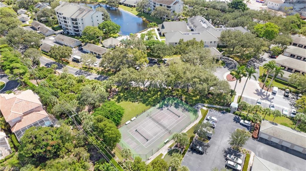 606 Arbor Lake Drive, Unit 6104 Naples, FL 34110 - Photo 34 of 36 an aerial view of a house with a yard