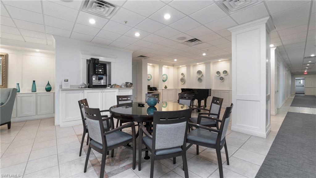 606 Arbor Lake Drive, Unit 6104 Naples, FL 34110 - Photo 36 of 36 a view of a dining room with furniture