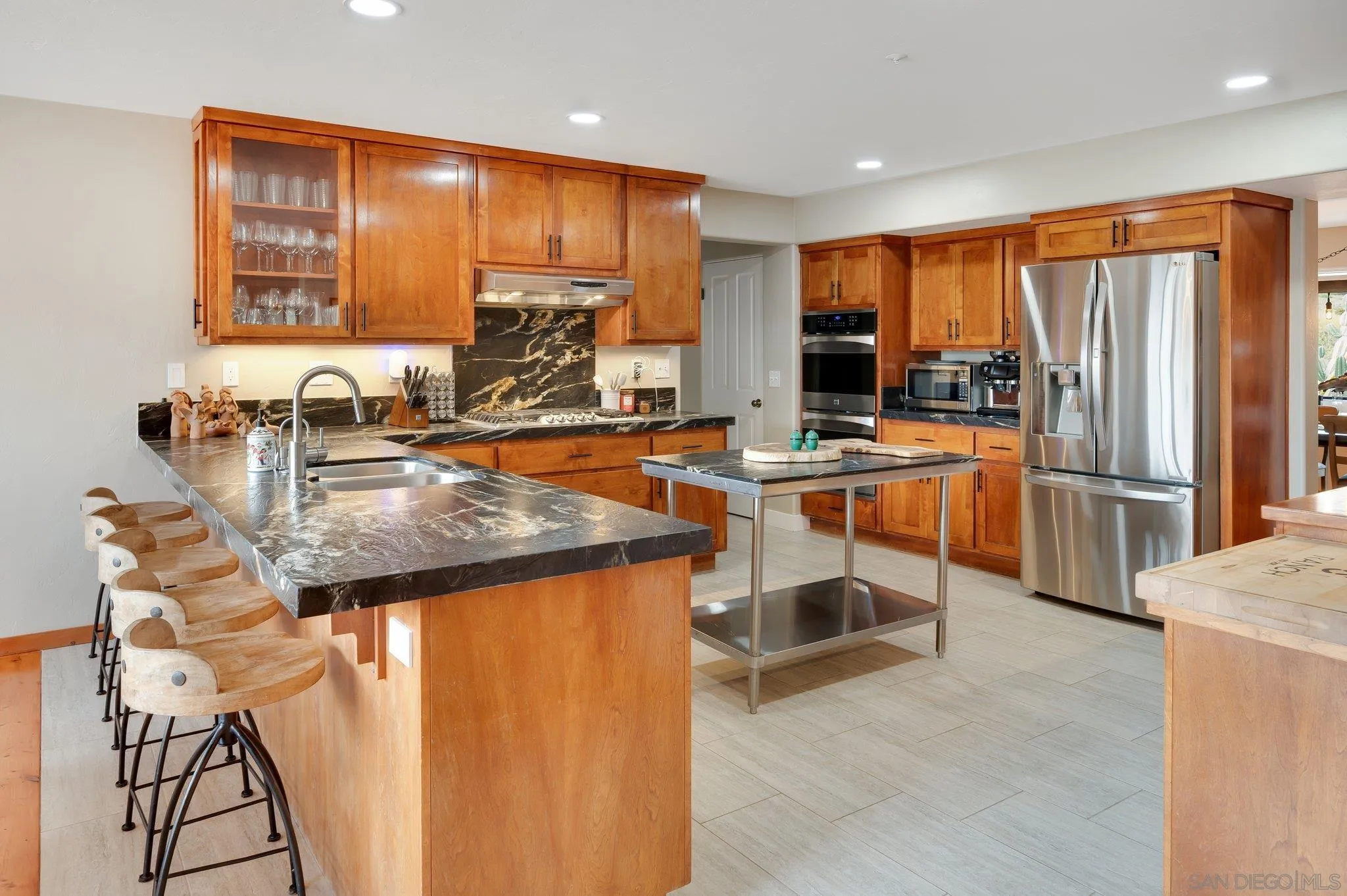 17287 Oak Hollow Road Ramona, CA 92065 - Photo 14 of 71 a kitchen with sink refrigerator and microwave